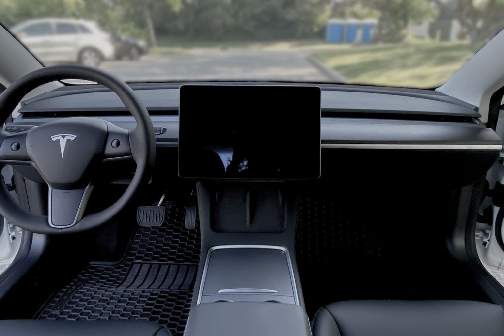 The cabin air filters in the Tesla Model 3 and Y are stored underneath the Centre Console