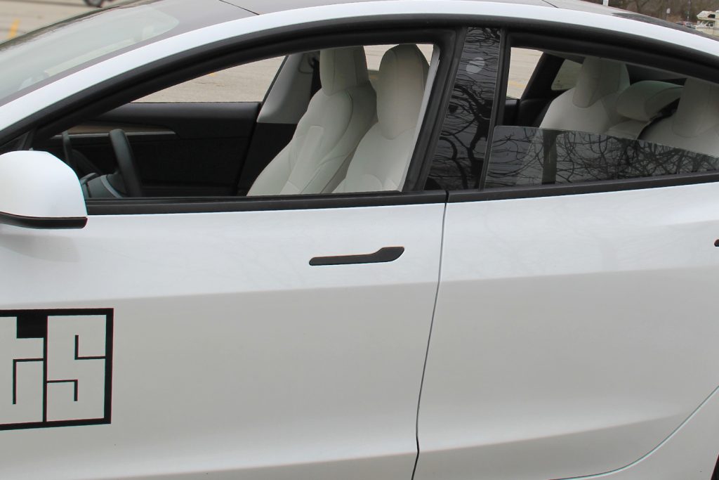 Pearl White Tesla Model 3 With White Seat Covers