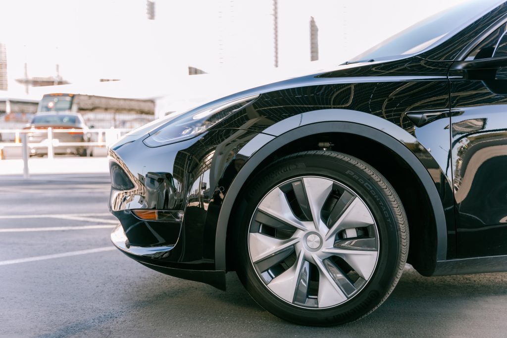 Solid Black Tesla Model 3 in a Parking Lot