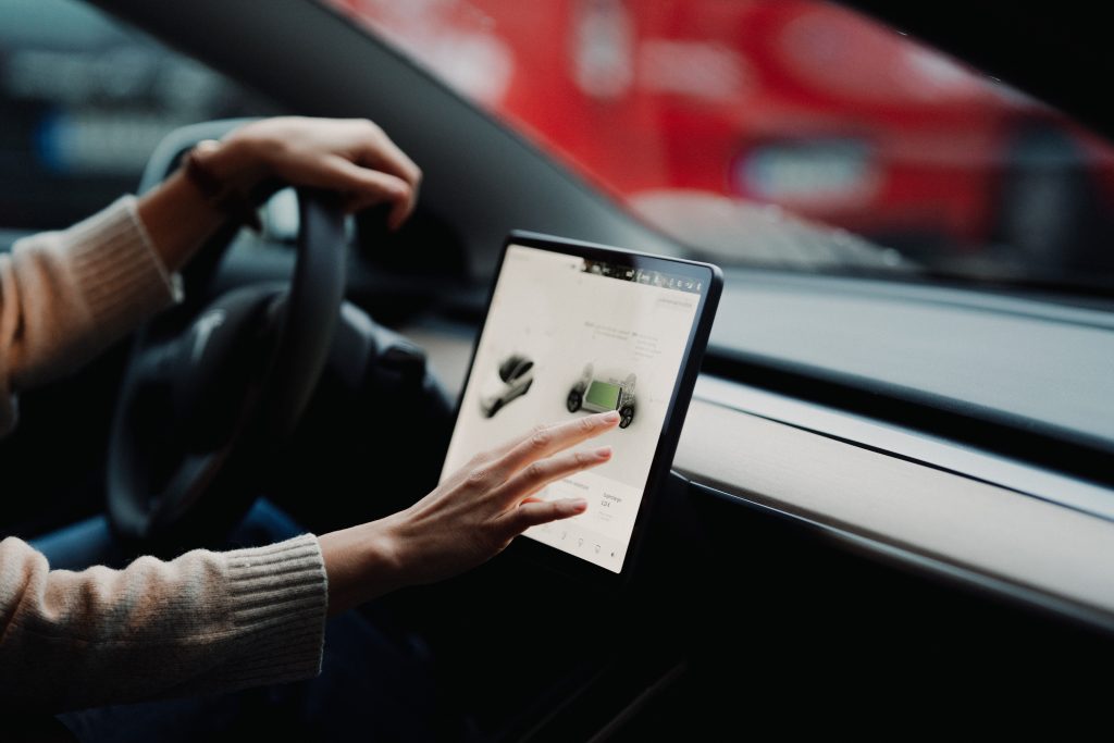 Person Setting a Charging Limit in a Tesla Model 3