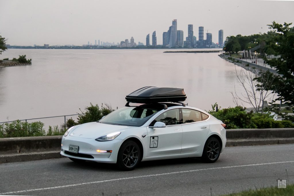 Pearl White Tesla Model 3 with the Tesloid Rooftop Cargo Box