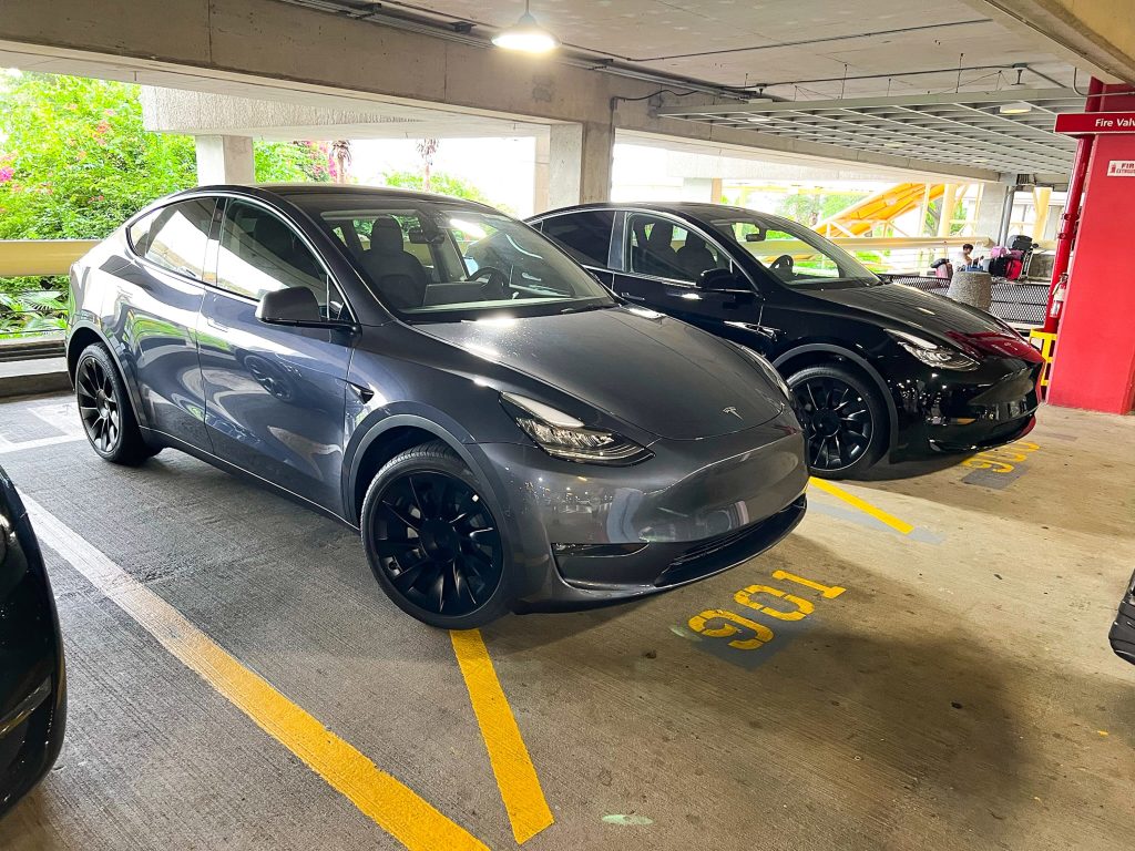 Midnight Silver Metallic Tesla Model Y in a Parking Garage