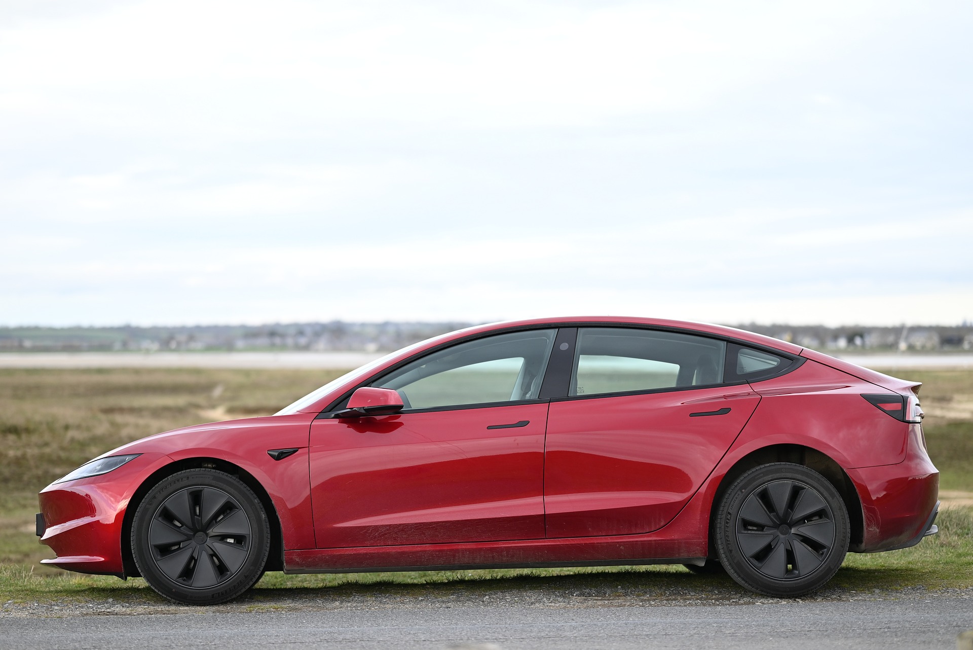 Red Tesla Model 3 Highland