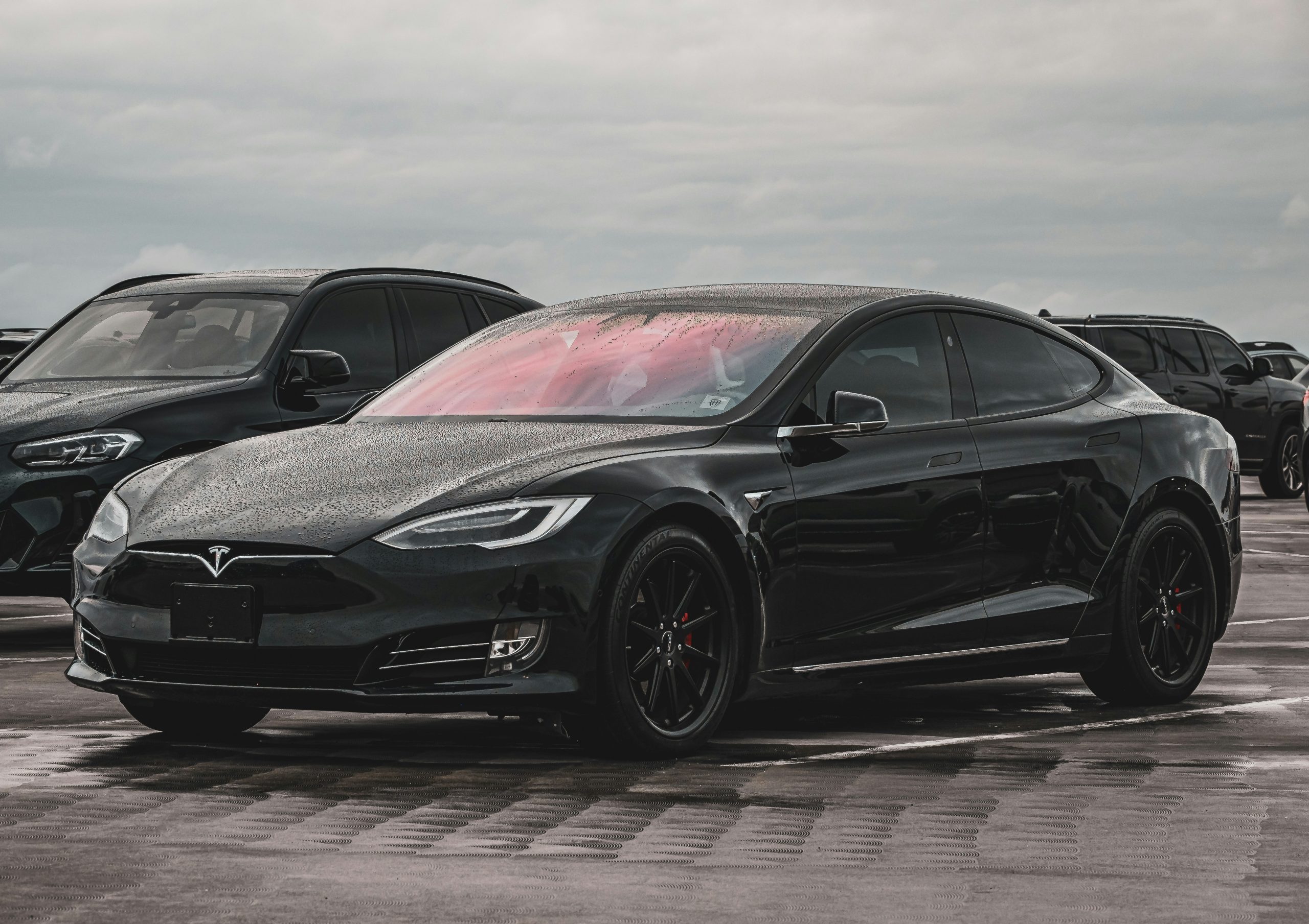 Solid Black Tesla Model S in a Parking Lot