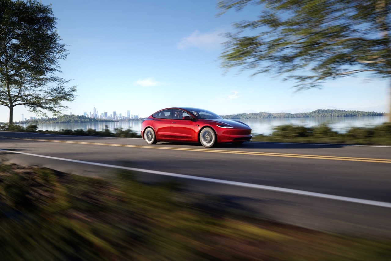 Tesla Model 3 Driving Fast on a Road in Track Mode