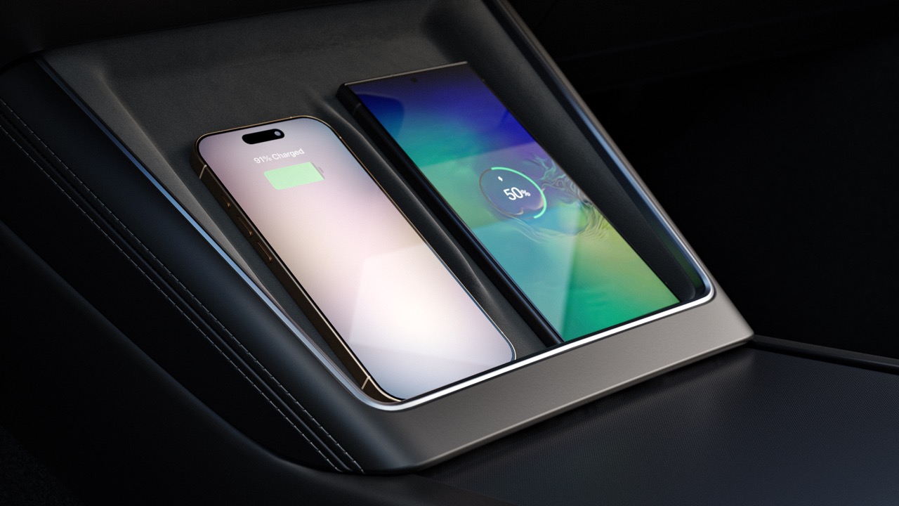 Two Mobile Phones Charging on a Wireless Charger in the Tesla Model Y