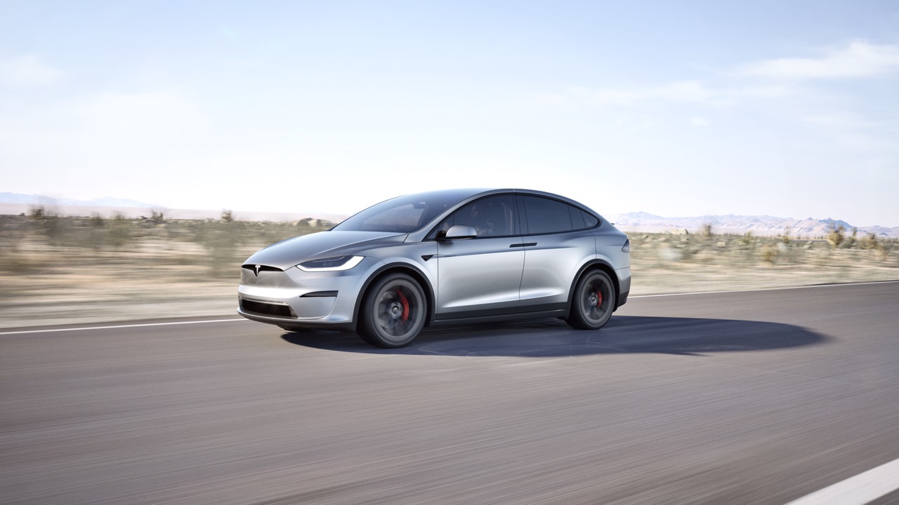 Tesla Model X with side mirrors.